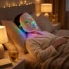 Woman relaxing with LED light therapy mask during evening routine